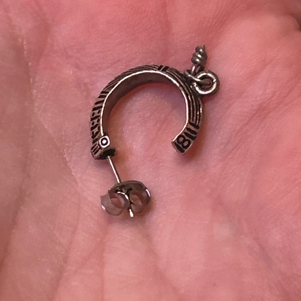 Vintage artisan-style silver hoop earrings (unmarked) with etched geo design